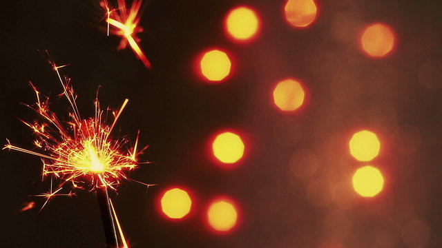 firework sparkler burning on bokeh light background, congratulation greeting  party happy new year,  christmas celebration concept
