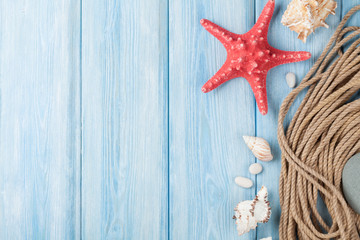 Fototapeta na wymiar Sea vacation background with star fish and marine rope