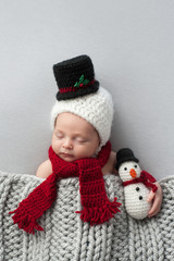 Newborn Baby Boy with Snowman Hat and Plush Toy