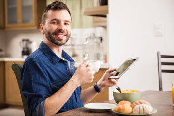 Man using a tablet at home