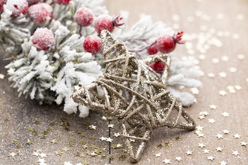 Naklejka premium Christmas decoration with fir branches on the wood background.