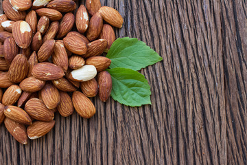 Almonds on wooden table , organic food