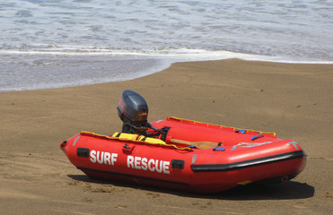 A rescue boat on the oceanfront waits for an emergency