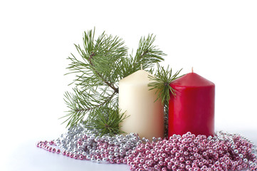 Candles, pine branch and christmas beads..