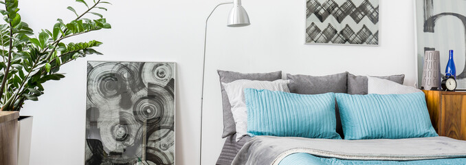 Grey and turquoise decorations in bedroom