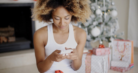 Serious woman checking for Christmas messages