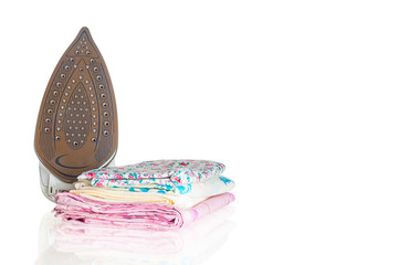 Steam iron and pile of clothes