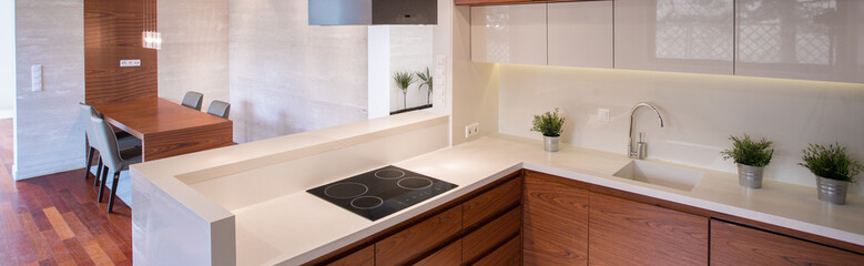 Clean kitchen with white tops