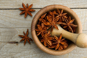 star anise in a wooden mortar
