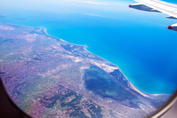 Flight Over Rhodes on deep blue sky background with soft focus