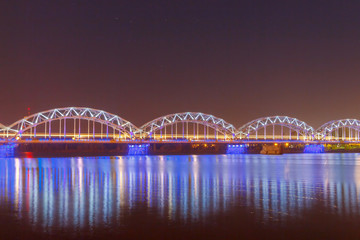 Fototapeta na wymiar Riga. Railway bridge at night.
