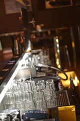 clean glasses behind the bar