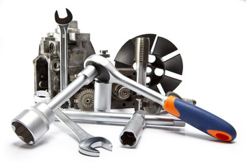 the part of car high pressure pump  and the tool for repair on white background..