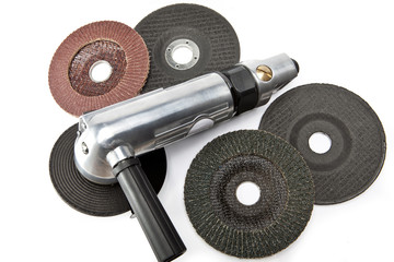 air angle grinder and different grinding wheels on white background..