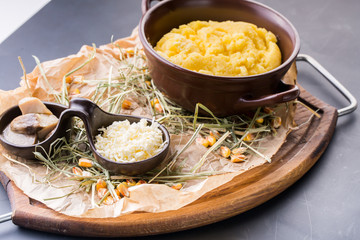 Decorated bowl with boiled couscous with mushroom and cheese