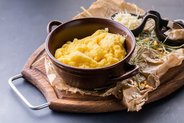 Decorated bowl with boiled couscous with mushroom and cheese