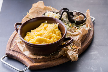 Decorated bowl with boiled couscous with mushroom and cheese