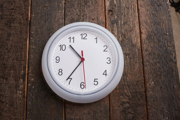 clock on a wooden wall