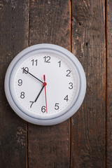 clock on a wooden wall