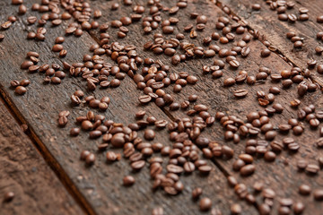 coffee beans scattered on the wooden table