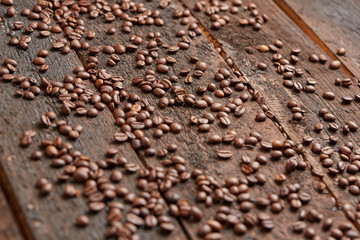 coffee beans scattered on the wooden table
