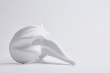white venetian mask on a white background