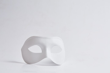 white venetian mask on a white background