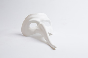 white venetian mask on a white background