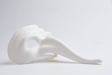 Fototapeta na wymiar white venetian mask on a white background