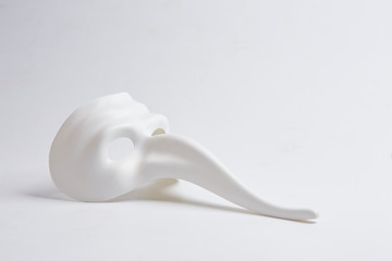 white venetian mask on a white background