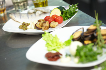 ingredients for a salad with fish and vegetables