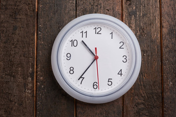 clock on a wooden wall