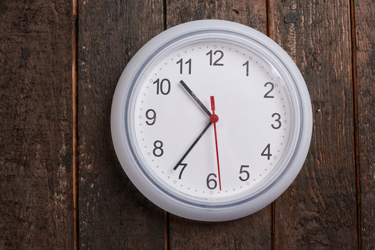 clock on a wooden wall