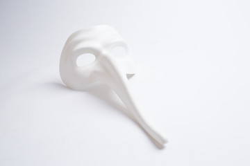 white venetian mask on a white background