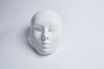 white venetian mask on a white background