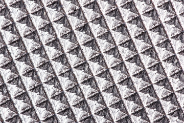 Abstract silver plastic rhombus texture.