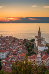 Sunset Over Adriatic Sea and Picturesque Old Town of Piran, Slovenia. Aerial View.
