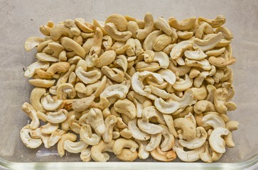 Cashew Nut on tile surface - accessory fruit (Anacardium occidentale)