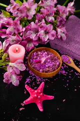 Obraz na płótnie Canvas Spa background-pink orchid , candle, salt in bowl, starfish