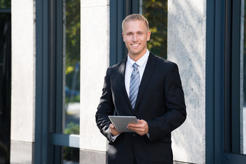 Businessman Holding Digital Tablet