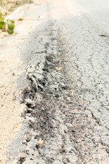 Restricted local government budgets are reflected in potholes and damaged roads