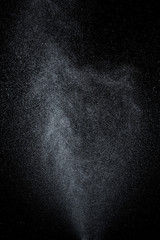 Abstract splashes and drops of water on black background.