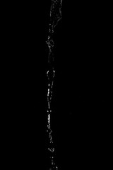 Abstract splashes and drops of water on black background.