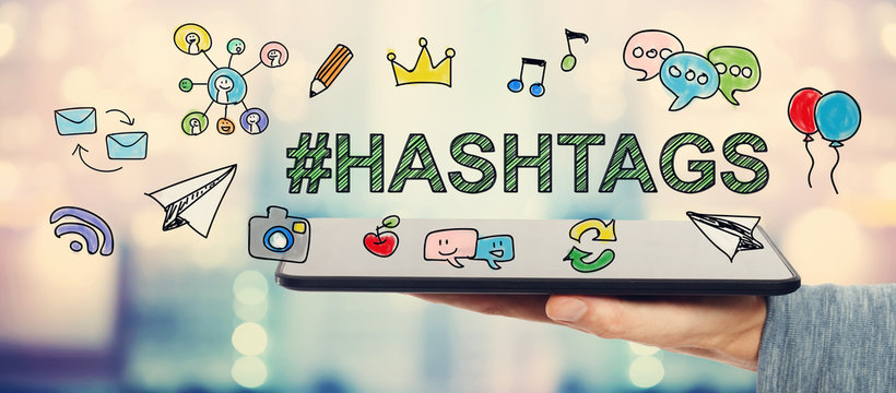 Hashtags concept with man holding a tablet