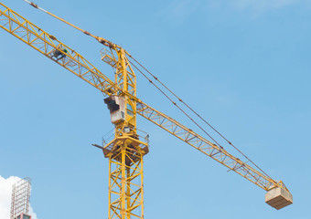 Construction site with cranes on sky background