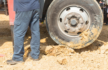 car tires and winch in dirt road