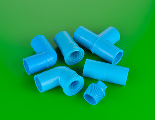 PVC pipe connection blue green background