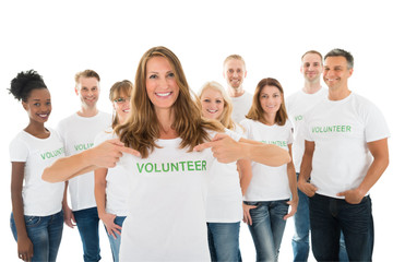 Happy Woman Showing Volunteer Text On Tshirt