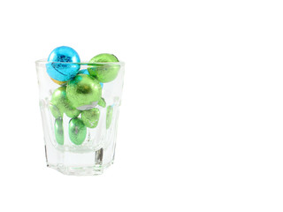 Chocolate Ball Wrap Up With Colorful Foil In Clear Glass Isolated On White Background