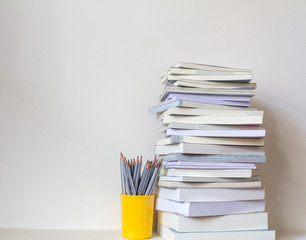 Close up book stacked  with concrete wall background